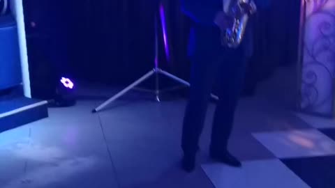 The musician plays the saxophone