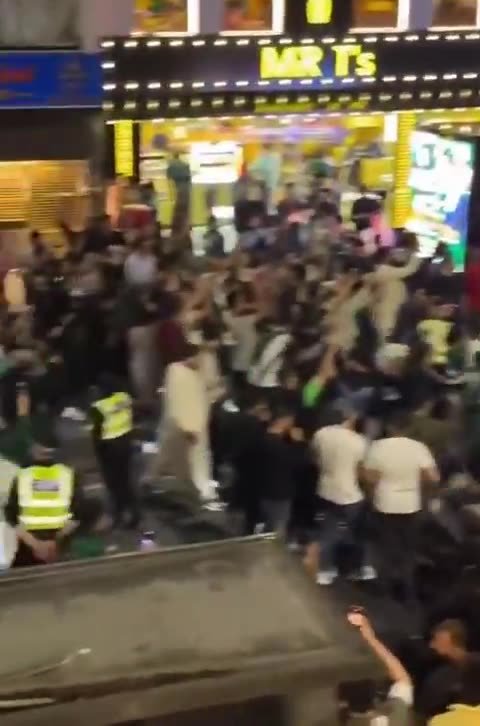 jewK ZOBbots dancing with feral invaders imported by jews in Manchester
