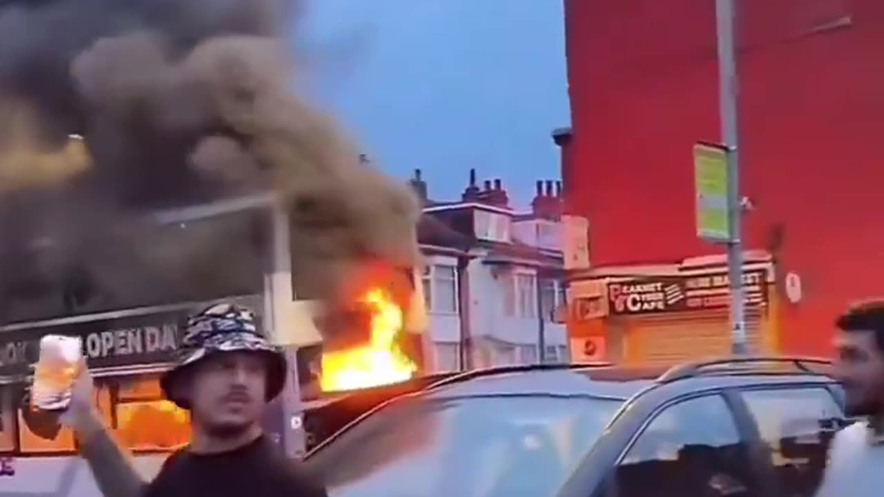 Several roma gipsy men set a bus on fire during last night's massive riots