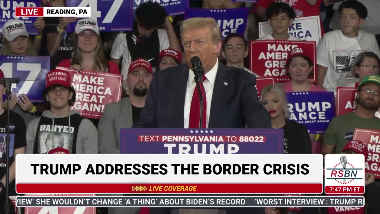 MORE ODD ACTIONS BY RALLY PERSON DURING SPEECH BY LADY WITH RED MAGA SIGN ON LEFT