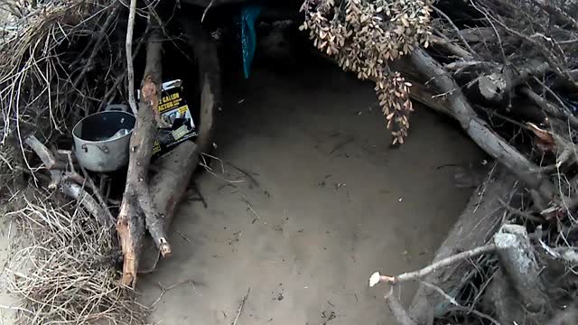 Homeless Guy Dug Out shelter in the woods [Gvmt owned real estate]