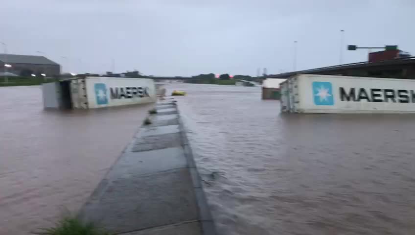 Shipping containers floating and strewn along the vicinity of the Old Durban Airport