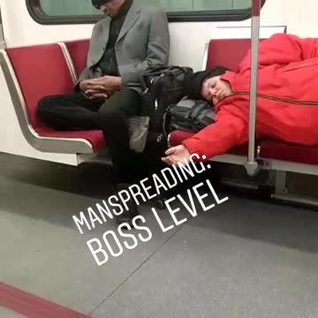 Manspreading: boss level red jacket kid lays down subway