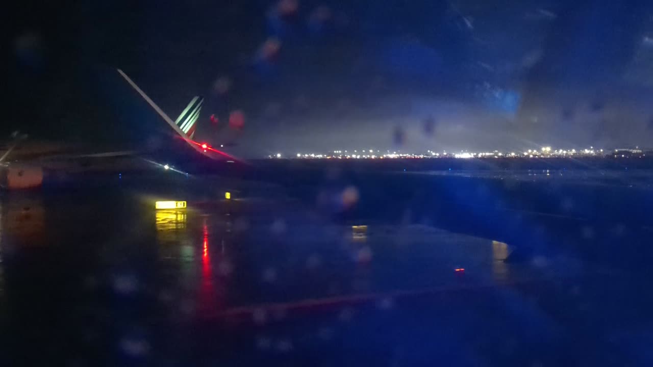 RAINY-NIGHT TAKE-OFF FROM NEW YORK'S J F K AIRPORT!