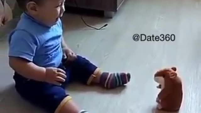 Baby afraid of toy