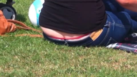 Blonde MILF Shows Her Red G-String at the Park