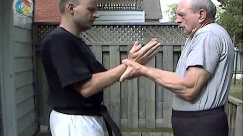 Baehr Taekwondo: white-belt-two-hand-holding-04-closeup