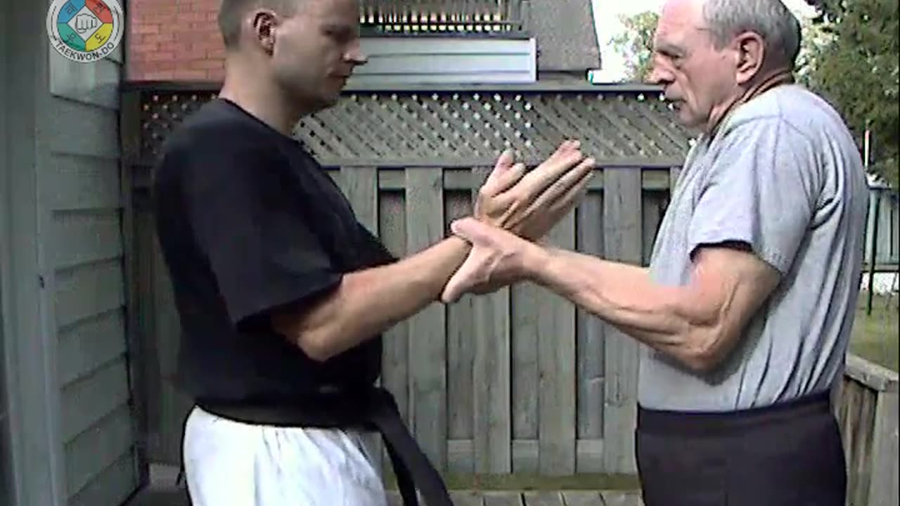 Baehr Taekwondo: white-belt-two-hand-holding-04-closeup