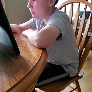 my little buddy playing on the tablet