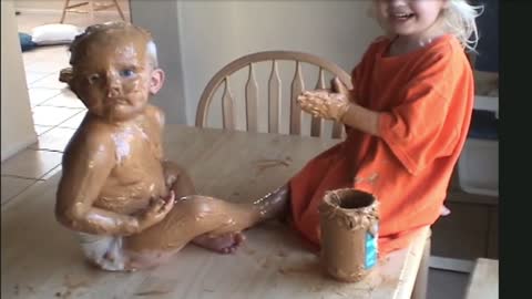 Funny Sister Covers Baby Brother in Peanut Butter