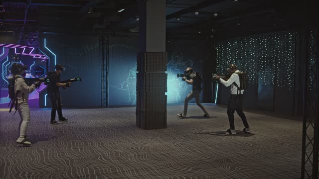 People Playing Video Game In Virtual Reality Mode