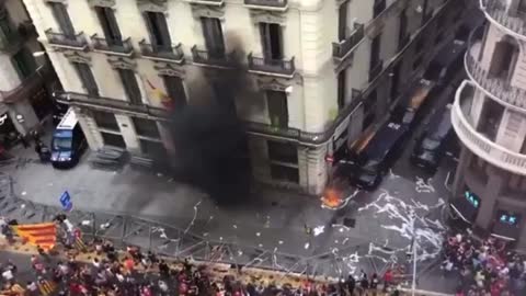 Spain: Demonstrators turned into Protesters in Barcelona as they set the police HQ On fire.