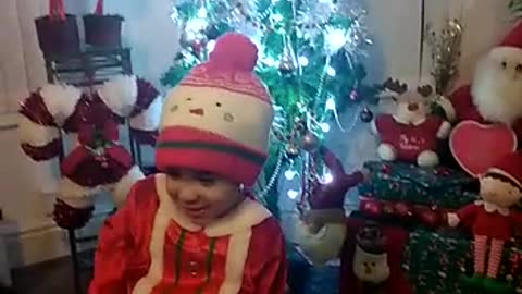 boy playing Santa Claus