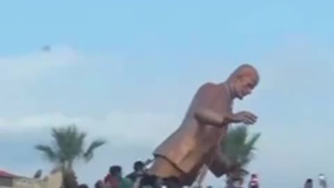 Locals Tear Down the Statue of Hafez Al-Assad