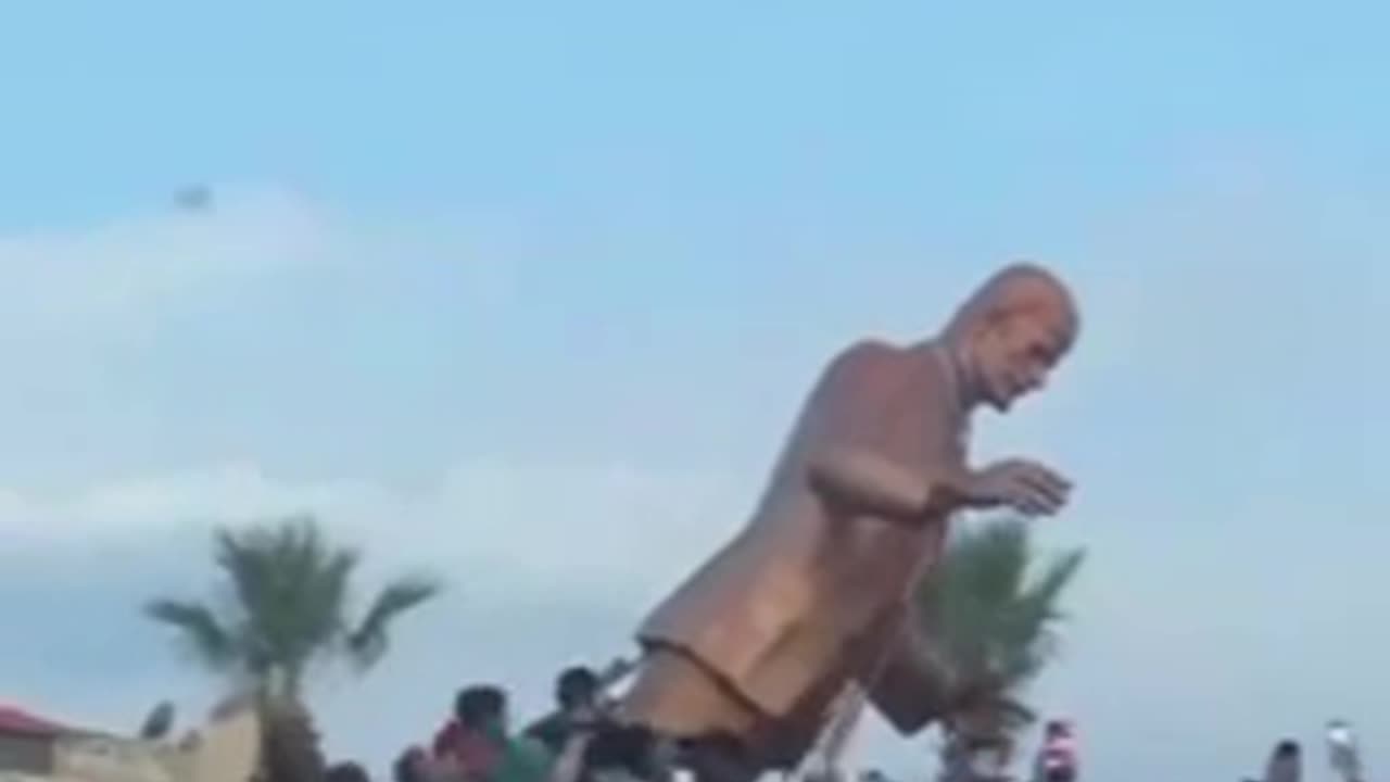 Locals Tear Down the Statue of Hafez Al-Assad