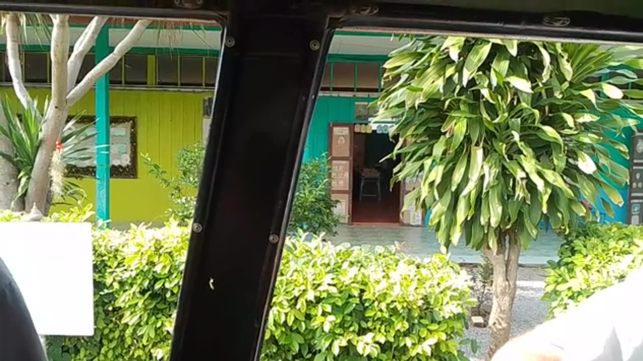 Arriving at a school near Hua Hin, Thailand