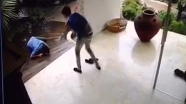 Security camera guy in blue slips on floor house