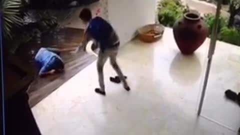 Security camera guy in blue slips on floor house