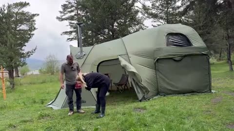 CAMPING_IN_A_TWO-STORY_TENT_DURING_A_DOWNPOUR