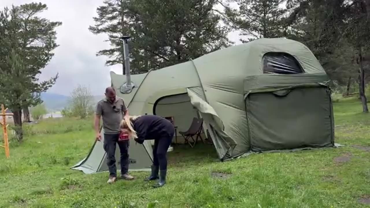 CAMPING_IN_A_TWO-STORY_TENT_DURING_A_DOWNPOUR