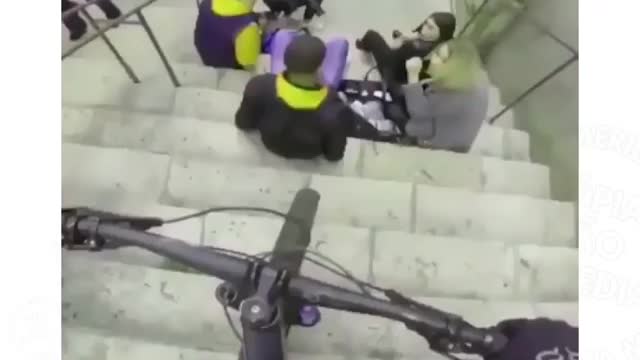 down the stairs by bike, over everything and everyone