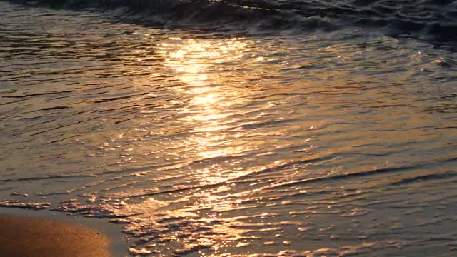 The sun shines on the beach.