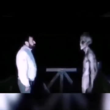 alien talking to human guy in a good way
