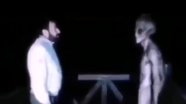 alien talking to human guy in a good way