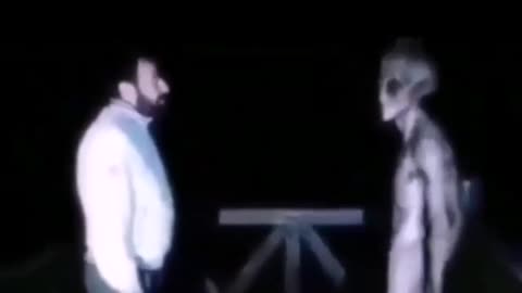 alien talking to human guy in a good way