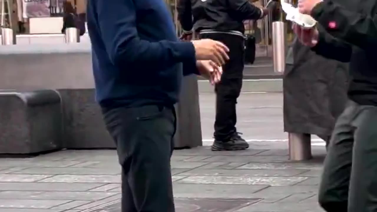 'World Health expert' Bill Gates seen in Times Square eating a hot dog without a care in the world.