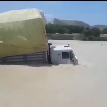 Truck goes through river