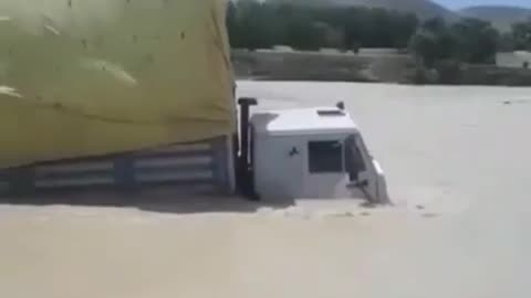 Truck goes through river