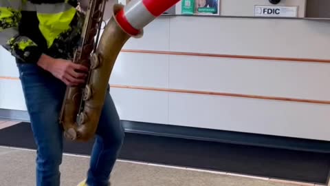 Traffic Cone Sax Man strikes at a bank