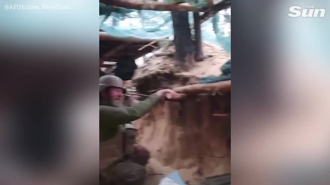 Ukrainian machine gunner fires at Russian forces from dugout