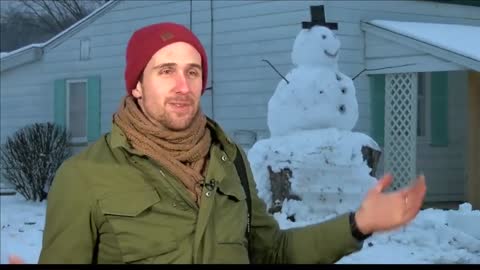 Driver tries to run over Kentucky snowman which had tree trunk has base