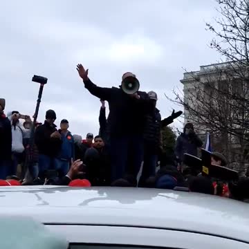 Alex Jones on Jan 6 on a bullhorn urging people away from the US Capitol. Ray Epps urged people in