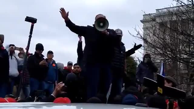 Alex Jones on Jan 6 on a bullhorn urging people away from the US Capitol. Ray Epps urged people in