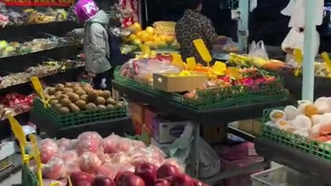 A fruit market in China in the night market.