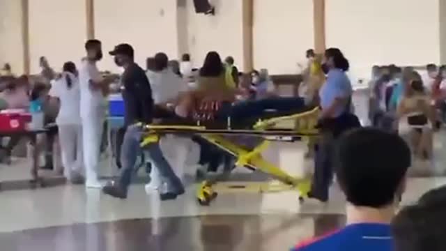 Caught On Film: Lady Wheeled Out Of The Covid-19 Vaccination Clinic On A Stretcher