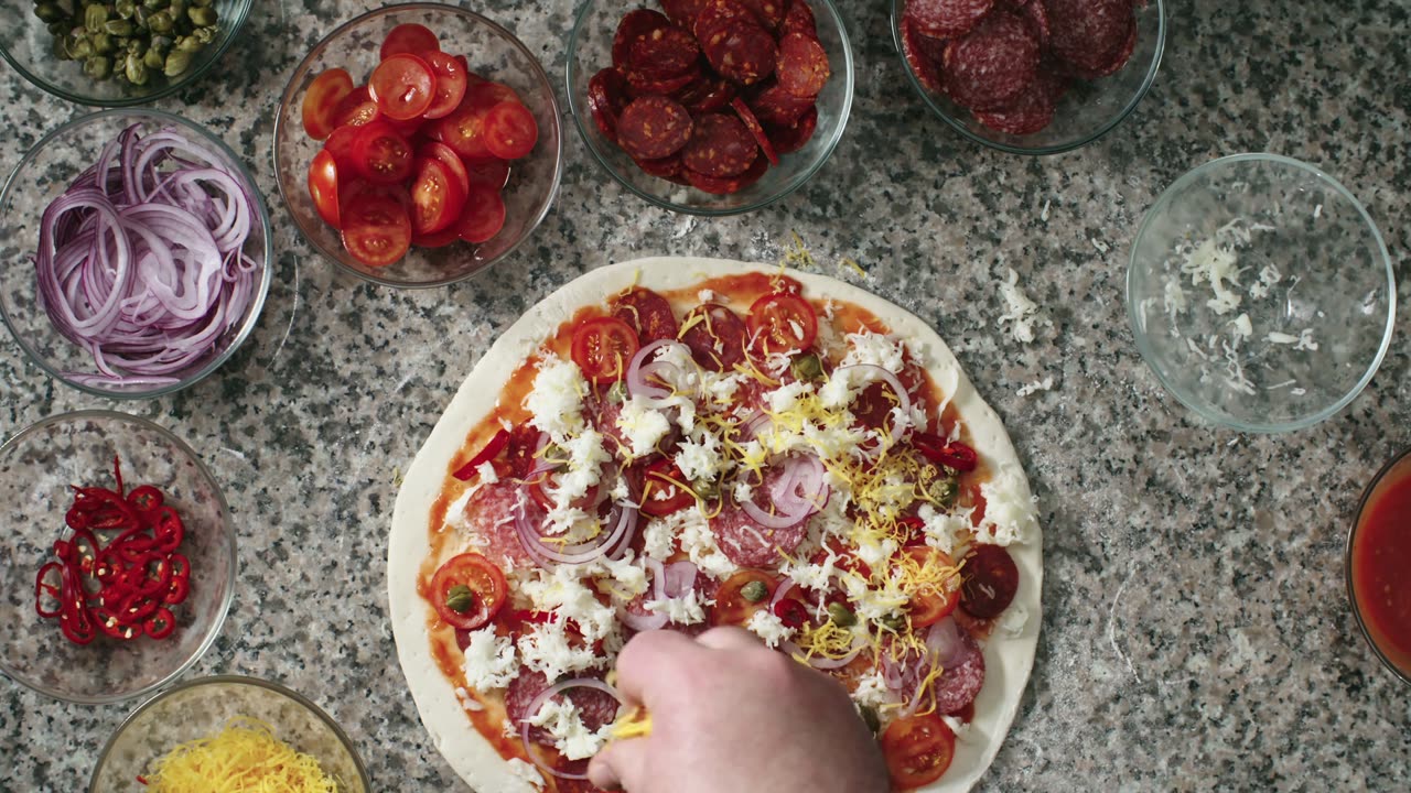 Making a pizza.