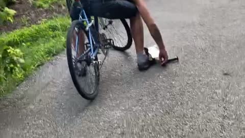 Man Apparently Falls Asleep While Riding Bike