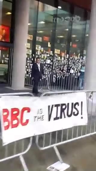 Stickers of the dead caused by adverse effects of vaccines are posted in the windows