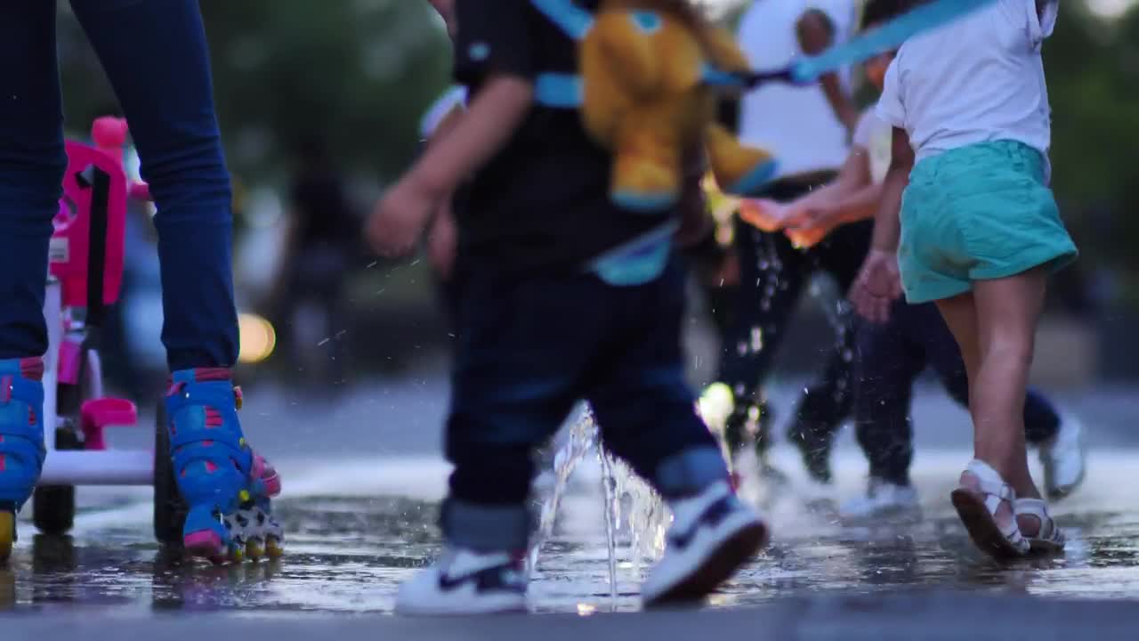 Children playing with a dancing fountain