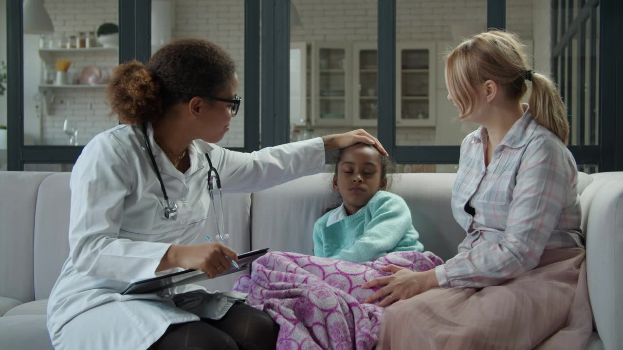 female doctor visiting a sick girl