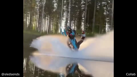 Crazy Guy Riding a Snowmobile over a Lake