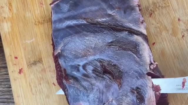 Cleaning up a bottom round roast from a deer