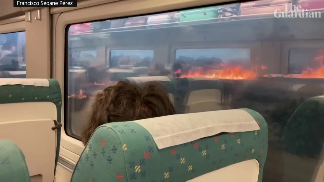 Spain heatwave: passengers struck in train surrounded by wildfires