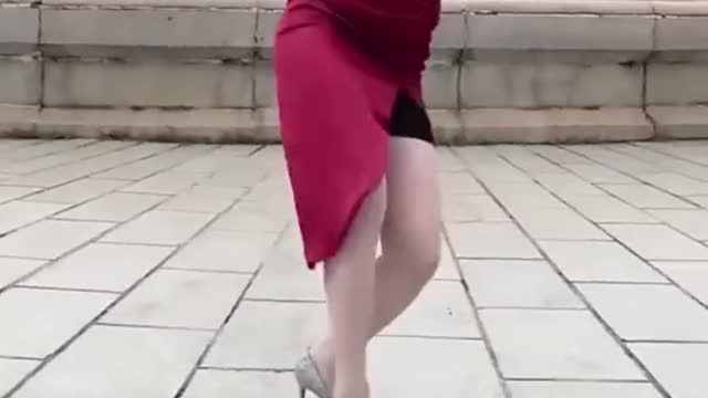 Amazing Beautiful Girl dressed in Red Dodging Bat