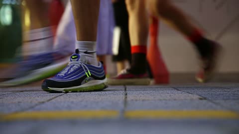 Close-ups, feet of people walking through the streets