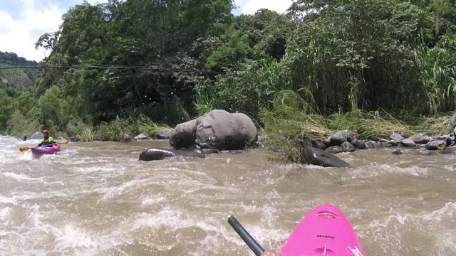 Kayaker's Paddle Breaks in Rapids